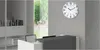 A modern office reception area with a clock on the wall. Produktbild-Vorschau