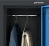 Interior view of a locker with clothes hanging on hangers. Anteprima dell’immagine prodotto
