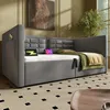 A modern bedroom or living room setting with a grey upholstered daybed. Anteprima dell’immagine prodotto