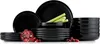 A set of black ceramic dishes, including plates and bowls, arranged on a white background. A pomegranate and cranberries are placed in the foreground. Náhled obrázku produktu