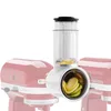 A food grinder attachment for a KitchenAid stand mixer is shown, with sliced zucchini inside the grinder. Voir les images du produit
