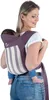 A woman is carrying a baby on her back using a baby carrier. Produktbild-Vorschau