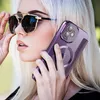 A woman wearing sunglasses holds a purple iPhone case to her ear. Produktbild-Vorschau