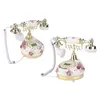 Two vintage-style rotary phones with floral patterns are shown against a white background. Náhľad obrázku produktu