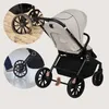 A collage showing a baby stroller in different scenarios: on sand and being used on a hard surface. Voir les images du produit