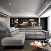 A modern living room with a large sectional sofa. Produktbild-Vorschau