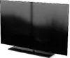 A black TV stand is shown from a diagonal angle against a white background. Produktbild-Vorschau