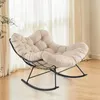 A beige upholstered rocking chair with a black metal frame is shown in a room with sheer curtains in the background. Anteprima dell’immagine prodotto