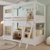 A child's bedroom featuring a white house-shaped bunk bed with a ladder, a teddy bear, and a play kitchen inside. Anteprima dell’immagine prodotto