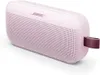 A pink Bose SoundLink Flex Bluetooth speaker with a burgundy strap. Produktbild-Vorschau