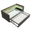 A sofa bed is shown in its partially opened state, revealing the mattress support structure and built-in storage compartments with LED lighting. Náhled obrázku produktu