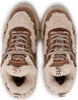 A top-down view of a pair of beige and brown Buffalo Cld Chai Warm sneakers with white fuzzy lining. Podgląd zdjęcia produktu