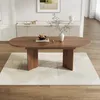 A dining room scene with an oval wooden table on a rug. Náhľad obrázku produktu