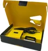 An opened black and yellow box containing a black device. Podgląd zdjęcia produktu