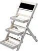 A white wooden plant stand with three tiers and a black chalkboard at the top, shown against a white background. Produktbild-Vorschau