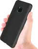 A hand holding a black smartphone case. Náhled obrázku produktu