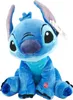 A plush toy of the character Stitch from Lilo & Stitch is sitting and facing the camera. Podgląd zdjęcia produktu