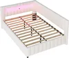 A white upholstered bed frame with a slatted base and LED lighting on the headboard. Náhled obrázku produktu