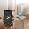 A hand holding a smartphone displaying a key finder app, with a set of keys and an AirTag on a table in the background. Produktbild-Vorschau