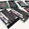 Several booster packs for the Magic: The Gathering card game are laid out on a white surface. Produktbild-Vorschau