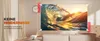 A projector is projecting an image of a wave onto a wall in a living room setting, with text overlays highlighting features. Produktbild-Vorschau