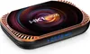 A product shot of a smart media player with a colorful, abstract design on top and a digital display on the front. Náhled obrázku produktu