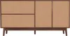 A front view of a wooden sideboard with rattan woven doors and drawers, set against a white background. Produktbild-Vorschau