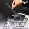 A hand is holding a steam diverter accessory over a kitchen appliance. Podgląd zdjęcia produktu
