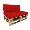 A red cushion set on a wooden pallet base, presented against a white background. Produktbild-Vorschau