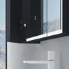 A close-up view of a modern bathroom cabinet with a mirror and a white faucet. Produktbild-Vorschau
