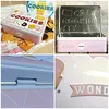 A collage of four images showing a decorative tin box for cookies. Voir les images du produit