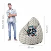 A man stands next to a bean bag chair with a skull and snake design, with dimensions indicated. Náhled obrázku produktu