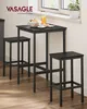 A black bar table set with two stools is placed near a window with a plant and a jug of orange juice on the table. Produktbild-Vorschau