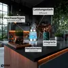 A modern kitchen counter with a glass electric kettle and kitchen utensils. Produktbild-Vorschau