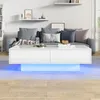 A modern living room scene with a white coffee table featuring LED lighting, a sofa with cushions, and shelves on the wall. Voir les images du produit