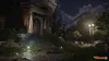 A dark, atmospheric scene of an overgrown building entrance at night, illuminated by streetlights and ground lights. The Division 2 logo is visible in the bottom right corner. Produktbild-Vorschau