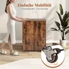 A woman is pushing a wooden cabinet with wheels, with a plant in a pot in the background. Podgląd zdjęcia produktu