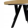 A close-up view of the leg structure and edge of a round table. Náhled obrázku produktu