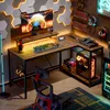 A gaming desk setup with a computer, keyboard, mouse, controllers, and ambient lighting. Anteprima dell’immagine prodotto