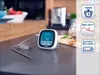 A digital kitchen thermometer with a probe resting on a countertop next to a loaf of bread. Náhled obrázku produktu