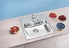 A stainless steel kitchen sink with a faucet is shown on a countertop, surrounded by bowls of fresh berries. Náhľad obrázku produktu