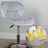 A grey upholstered office chair with a chrome base and a circular inset showing hands in yellow gloves cleaning the chair with a pink sponge. Podgląd zdjęcia produktu