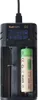 A close-up shot of a battery charger with a battery inserted. Produktbild-Vorschau