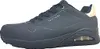 A side view of a black Skechers sneaker with a gold accent on the heel. Voir les images du produit