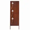 A decorative garden screen with a rust finish, featuring three stylized white grass blades. Produktbild-Vorschau