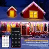 A red house decorated with colorful icicle lights and string lights during winter at night. Produktbild-Vorschau