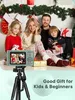 A family posing for a photo with a digital camera and Christmas decorations. Produktbild-Vorschau
