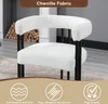 A close-up shot of a white, plush armchair with a black metal frame, set against a blurred background. The bottom of the image features three circular icons with accompanying text related to product features. Produktbild-Vorschau
