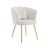 A white velvet accent chair with gold legs and a decorative pillow. Náhled obrázku produktu