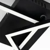 A close-up view of a modern black and white geometric LED ceiling light fixture. Produktbild-Vorschau
